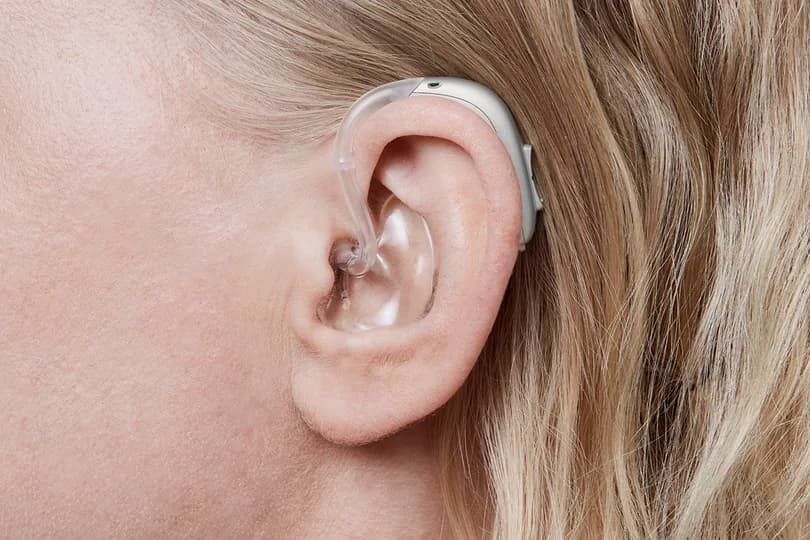Behind-The-Ear hearing aid shown in ear