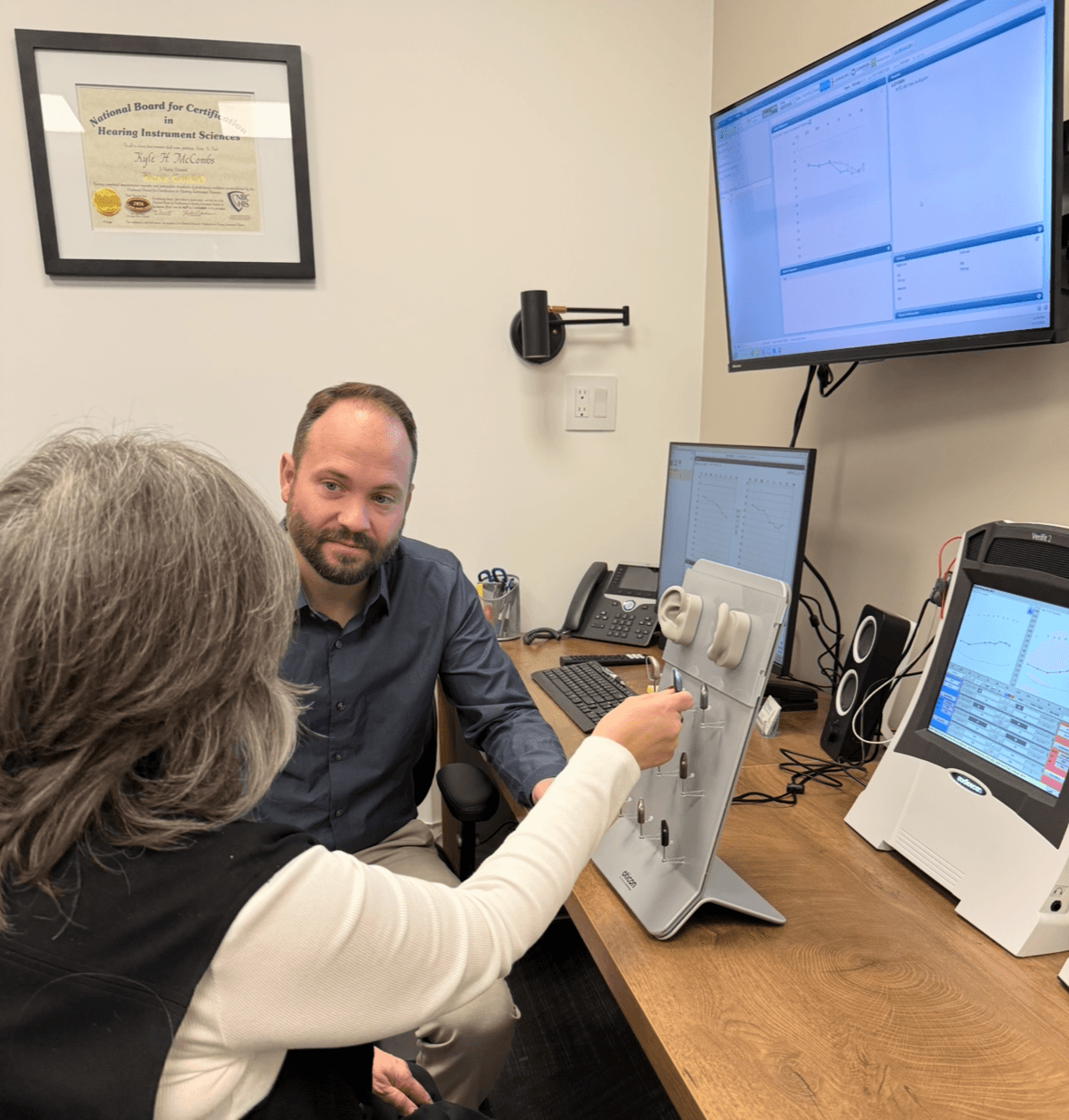 Looking at hearing aids at Prairie Hearing Centre