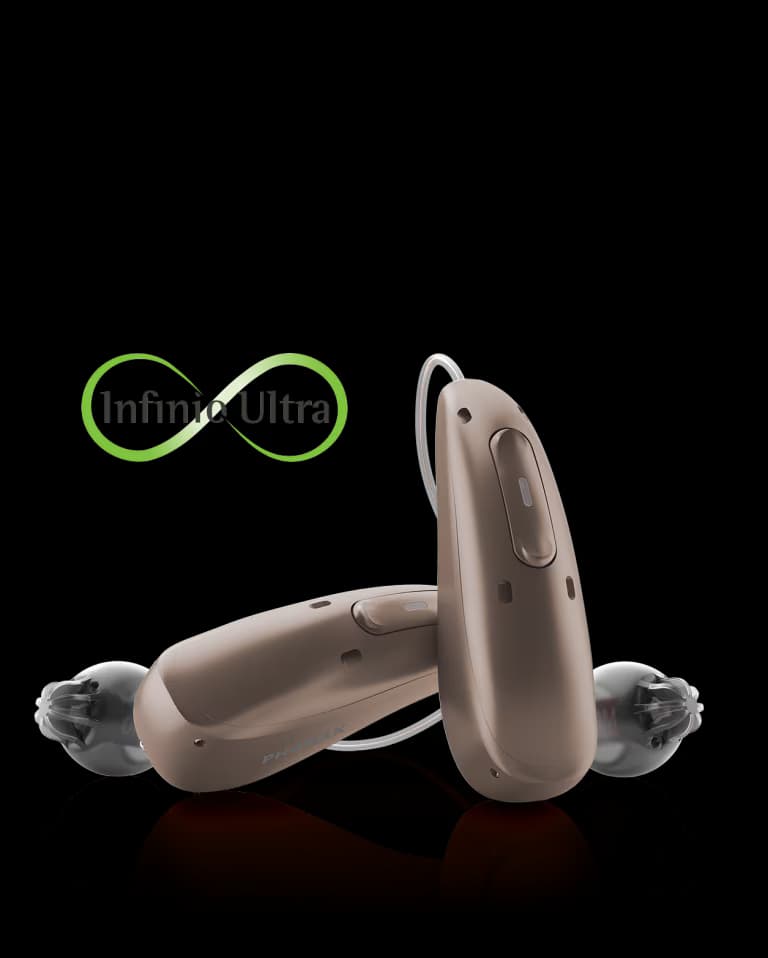 A pair of Phonak Audéo Infinio Ultra Sphere hearing aids with the Infinio Ultra mark, fitted at Prairie Hearing Centre in Winnipeg
